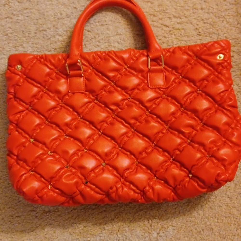 Red handbag with gold studs